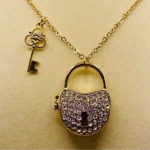 Heart rhinestone locket and key charm necklace by Claire’s. 32 inches long.